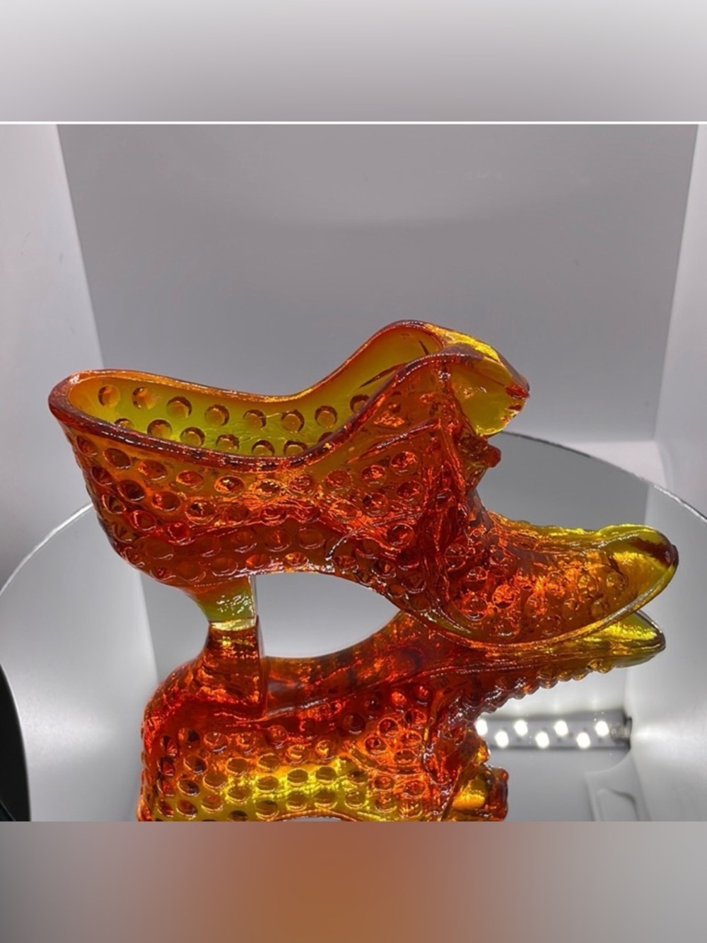 Fenton  Amberina hobnail cats head slipper. Glows under UV …